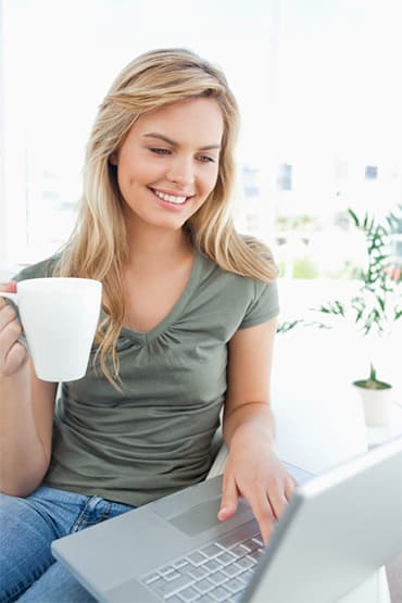 Girl taking an online course Woman taking a real estate course online